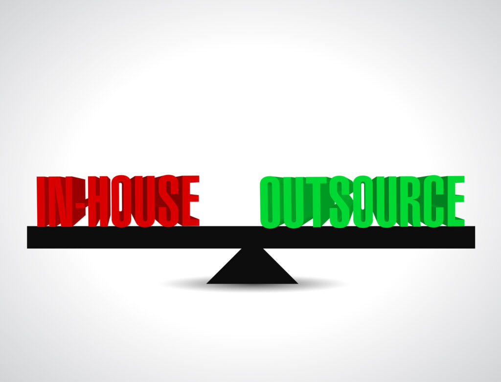 in house and outsource being weighed on a scale